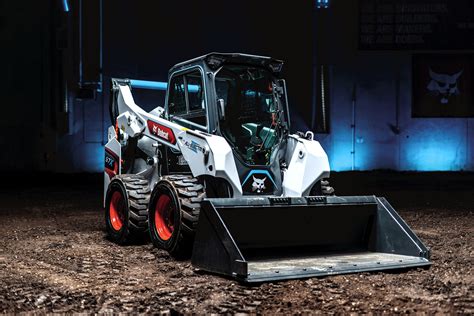 bobcat skid steer bouncing down the road|bobcat stand behind skid steer.